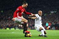 MANCHESTER, ENGLAND - FEBRUARY 11: Zlatan Ibrahimovic of Manchester United and Younes Kaboul of Watford compete for the ball during the Premier League match between Manchester United and Watford at Old Trafford on February 11, 2017 in Manchester, England.  (Photo by Mark Thompson/Getty Images)